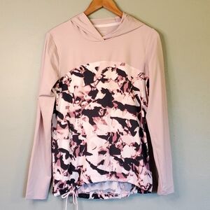 Under Armour Women's long sleeve pullover. Pale blush and black design. Size S.